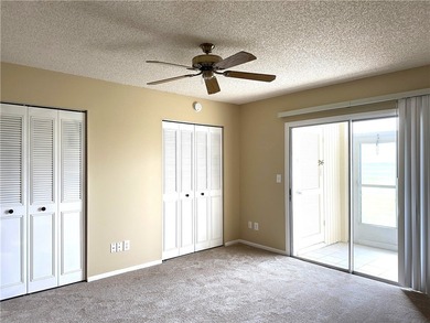 1ST FLOOR condo overlooking the fairway from the living room on The American Golf Club in Florida - for sale on GolfHomes.com, golf home, golf lot