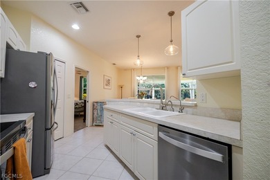 Welcome to this beautifully maintained Ibis II model home in the on Herons Glen Golf and Country Club in Florida - for sale on GolfHomes.com, golf home, golf lot
