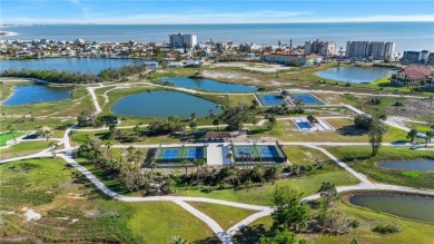 Discover this exceptional 4-bedroom, 3-bathroom end-unit on Fort Myers Beach and Golf Club in Florida - for sale on GolfHomes.com, golf home, golf lot