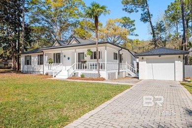This charming, updated home with a wraparound front porch is on Lake Forest Yacht and Country Club in Alabama - for sale on GolfHomes.com, golf home, golf lot