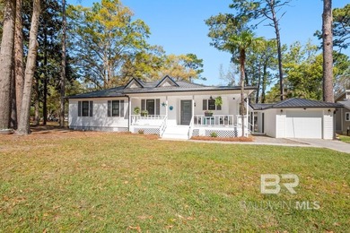 This charming, updated home with a wraparound front porch is on Lake Forest Yacht and Country Club in Alabama - for sale on GolfHomes.com, golf home, golf lot