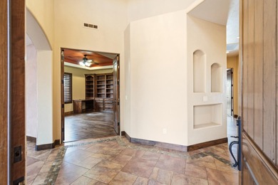 This home has stunning views of Kachina Cliffs, the Entrada Golf on Entrada at Snow Canyon in Utah - for sale on GolfHomes.com, golf home, golf lot