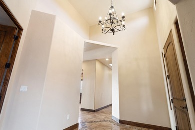 This home has stunning views of Kachina Cliffs, the Entrada Golf on Entrada at Snow Canyon in Utah - for sale on GolfHomes.com, golf home, golf lot