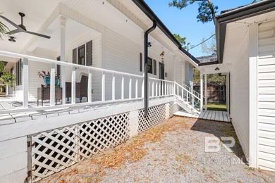 This charming, updated home with a wraparound front porch is on Lake Forest Yacht and Country Club in Alabama - for sale on GolfHomes.com, golf home, golf lot