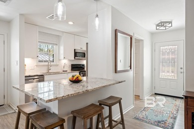 This charming, updated home with a wraparound front porch is on Lake Forest Yacht and Country Club in Alabama - for sale on GolfHomes.com, golf home, golf lot