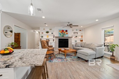 This charming, updated home with a wraparound front porch is on Lake Forest Yacht and Country Club in Alabama - for sale on GolfHomes.com, golf home, golf lot