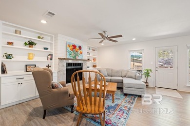 This charming, updated home with a wraparound front porch is on Lake Forest Yacht and Country Club in Alabama - for sale on GolfHomes.com, golf home, golf lot