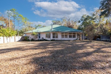 Welcome to your dream home nestled in the heart of Chiefland on Chiefland Golf and Country Club in Florida - for sale on GolfHomes.com, golf home, golf lot