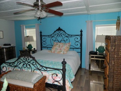 This 26x48 1984 Ventura home is located on a coveted corner lot on Grasslands Golf and Country Club in Florida - for sale on GolfHomes.com, golf home, golf lot