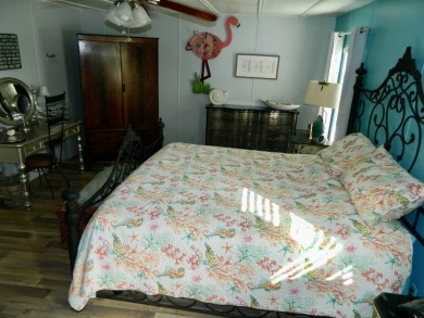 This 26x48 1984 Ventura home is located on a coveted corner lot on Grasslands Golf and Country Club in Florida - for sale on GolfHomes.com, golf home, golf lot