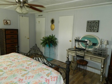This 26x48 1984 Ventura home is located on a coveted corner lot on Grasslands Golf and Country Club in Florida - for sale on GolfHomes.com, golf home, golf lot