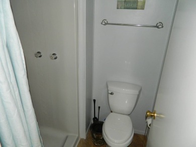 This 26x48 1984 Ventura home is located on a coveted corner lot on Grasslands Golf and Country Club in Florida - for sale on GolfHomes.com, golf home, golf lot