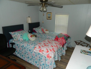 This 26x48 1984 Ventura home is located on a coveted corner lot on Grasslands Golf and Country Club in Florida - for sale on GolfHomes.com, golf home, golf lot