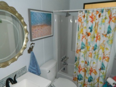 This 26x48 1984 Ventura home is located on a coveted corner lot on Grasslands Golf and Country Club in Florida - for sale on GolfHomes.com, golf home, golf lot