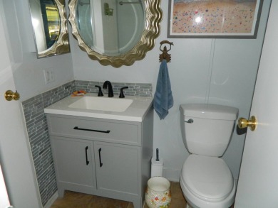 This 26x48 1984 Ventura home is located on a coveted corner lot on Grasslands Golf and Country Club in Florida - for sale on GolfHomes.com, golf home, golf lot