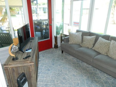 This 26x48 1984 Ventura home is located on a coveted corner lot on Grasslands Golf and Country Club in Florida - for sale on GolfHomes.com, golf home, golf lot