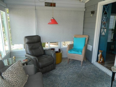 This 26x48 1984 Ventura home is located on a coveted corner lot on Grasslands Golf and Country Club in Florida - for sale on GolfHomes.com, golf home, golf lot