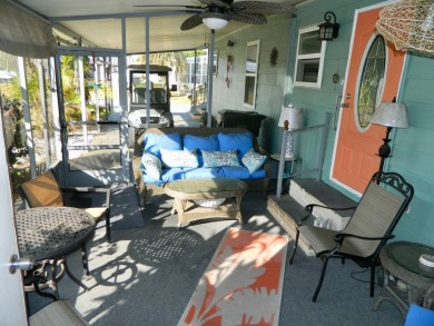 This 26x48 1984 Ventura home is located on a coveted corner lot on Grasslands Golf and Country Club in Florida - for sale on GolfHomes.com, golf home, golf lot