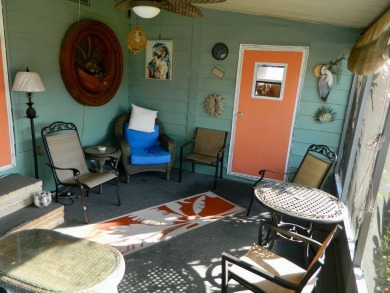 This 26x48 1984 Ventura home is located on a coveted corner lot on Grasslands Golf and Country Club in Florida - for sale on GolfHomes.com, golf home, golf lot