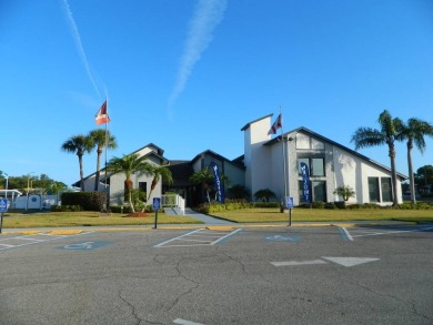 This 26x48 1984 Ventura home is located on a coveted corner lot on Grasslands Golf and Country Club in Florida - for sale on GolfHomes.com, golf home, golf lot