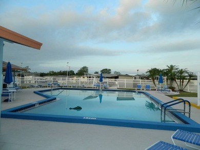 This 26x48 1984 Ventura home is located on a coveted corner lot on Grasslands Golf and Country Club in Florida - for sale on GolfHomes.com, golf home, golf lot