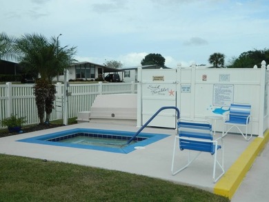 This 26x48 1984 Ventura home is located on a coveted corner lot on Grasslands Golf and Country Club in Florida - for sale on GolfHomes.com, golf home, golf lot