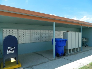 This 26x48 1984 Ventura home is located on a coveted corner lot on Grasslands Golf and Country Club in Florida - for sale on GolfHomes.com, golf home, golf lot