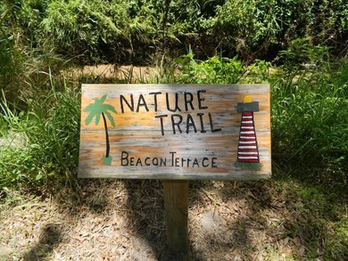 This 26x48 1984 Ventura home is located on a coveted corner lot on Grasslands Golf and Country Club in Florida - for sale on GolfHomes.com, golf home, golf lot