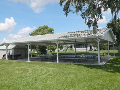 This 26x48 1984 Ventura home is located on a coveted corner lot on Grasslands Golf and Country Club in Florida - for sale on GolfHomes.com, golf home, golf lot