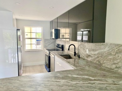 Fully remodeled corner 3BR/2BA condo bathed in natural light on Palm-Aire Country Club and Resort - The Oaks in Florida - for sale on GolfHomes.com, golf home, golf lot