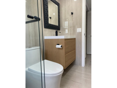 Fully remodeled corner 3BR/2BA condo bathed in natural light on Palm-Aire Country Club and Resort - The Oaks in Florida - for sale on GolfHomes.com, golf home, golf lot