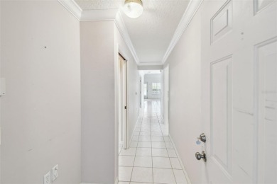 Welcome to one of the desirable homes in the Villas at on Feather Sound Country Club in Florida - for sale on GolfHomes.com, golf home, golf lot