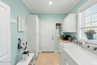 Experience the perfect blend of coastal charm and golf course on Lockwood Folly Country Club in North Carolina - for sale on GolfHomes.com, golf home, golf lot