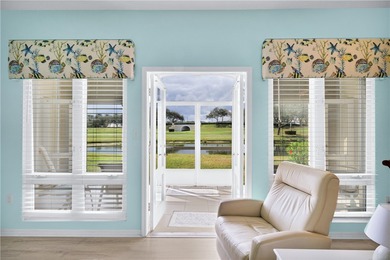 This 2 bedroom, 2 bath Harmony Island condo is Florida living at on Oak Harbor Country Club in Florida - for sale on GolfHomes.com, golf home, golf lot