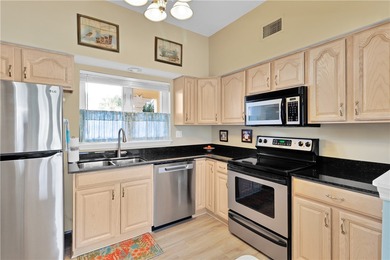 This 2 bedroom, 2 bath Harmony Island condo is Florida living at on Oak Harbor Country Club in Florida - for sale on GolfHomes.com, golf home, golf lot