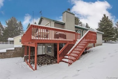 Welcome to this inviting raised ranch style home nestled within on Lost Lake Woods Club in Michigan - for sale on GolfHomes.com, golf home, golf lot