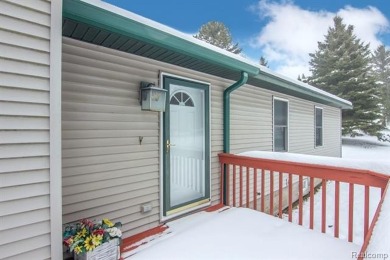 Welcome to this inviting raised ranch style home nestled within on Lost Lake Woods Club in Michigan - for sale on GolfHomes.com, golf home, golf lot