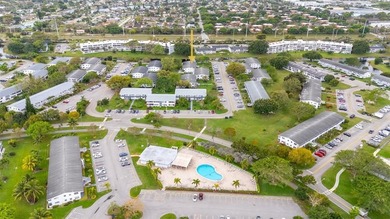 BEAUTIFULLY REMODELED, FIRST FLOOR 2 BEDROOM, 1.5 BATH CONDO on Hillsboro Pines Golf in Florida - for sale on GolfHomes.com, golf home, golf lot