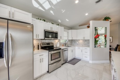 Enjoy beautiful lake views from one of the largest 3 bedroom on PGA National Golf Club in Florida - for sale on GolfHomes.com, golf home, golf lot