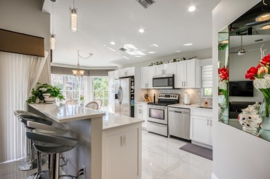 Enjoy beautiful lake views from one of the largest 3 bedroom on PGA National Golf Club in Florida - for sale on GolfHomes.com, golf home, golf lot