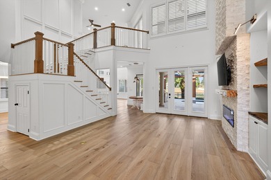 This exquisite home, located on the 15th green of Regatta Bay's on Regatta Bay Golf and Country Club in Florida - for sale on GolfHomes.com, golf home, golf lot