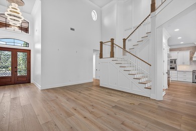 This exquisite home, located on the 15th green of Regatta Bay's on Regatta Bay Golf and Country Club in Florida - for sale on GolfHomes.com, golf home, golf lot