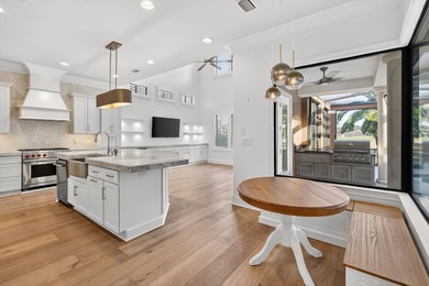 This exquisite home, located on the 15th green of Regatta Bay's on Regatta Bay Golf and Country Club in Florida - for sale on GolfHomes.com, golf home, golf lot