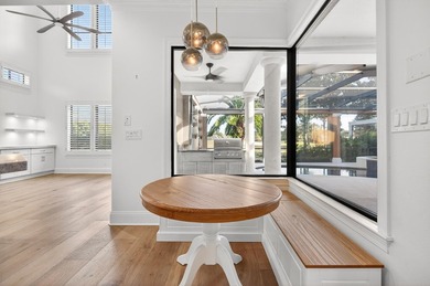 This exquisite home, located on the 15th green of Regatta Bay's on Regatta Bay Golf and Country Club in Florida - for sale on GolfHomes.com, golf home, golf lot