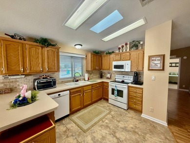 Home is located in Water Oak Country Club Estates in Lady Lake on Water Oak Country Club Estates in Florida - for sale on GolfHomes.com, golf home, golf lot