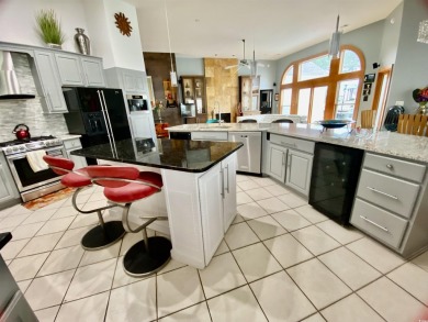 STUNNING HOME WITH WATER & GOLF COURSE VIEWS-YOUR EVERYDAY on Sandpiper Bay Golf and Country Club in North Carolina - for sale on GolfHomes.com, golf home, golf lot