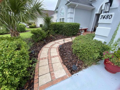 STUNNING HOME WITH WATER & GOLF COURSE VIEWS-YOUR EVERYDAY on Sandpiper Bay Golf and Country Club in North Carolina - for sale on GolfHomes.com, golf home, golf lot