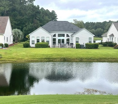 STUNNING HOME WITH WATER & GOLF COURSE VIEWS-YOUR EVERYDAY on Sandpiper Bay Golf and Country Club in North Carolina - for sale on GolfHomes.com, golf home, golf lot
