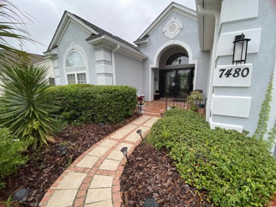 STUNNING HOME WITH WATER & GOLF COURSE VIEWS-YOUR EVERYDAY on Sandpiper Bay Golf and Country Club in North Carolina - for sale on GolfHomes.com, golf home, golf lot