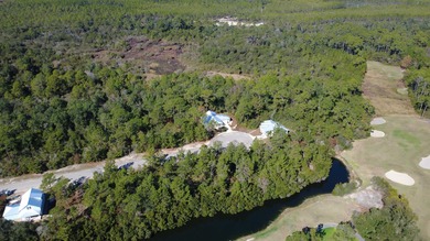 Experience golf community living on this beautifully wooded lot on St. James Bay in Florida - for sale on GolfHomes.com, golf home, golf lot